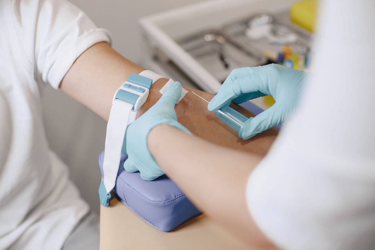 Healthcare professional drawing a blood sample to check vitamin levels